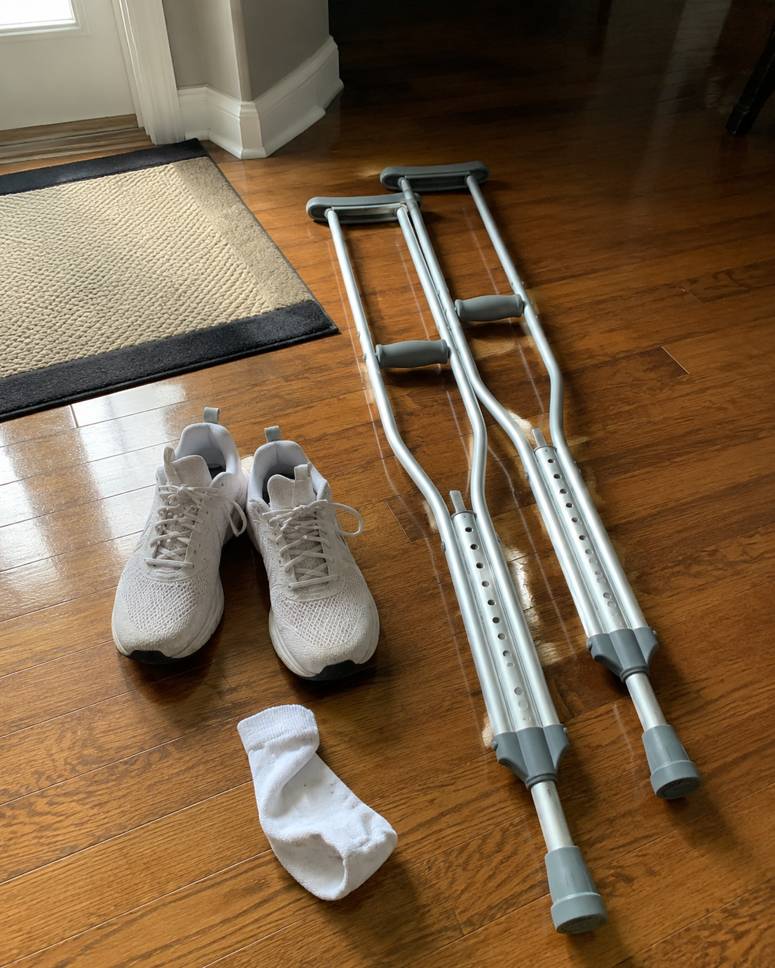 Crutches and walking shoes at home after the hospital stay